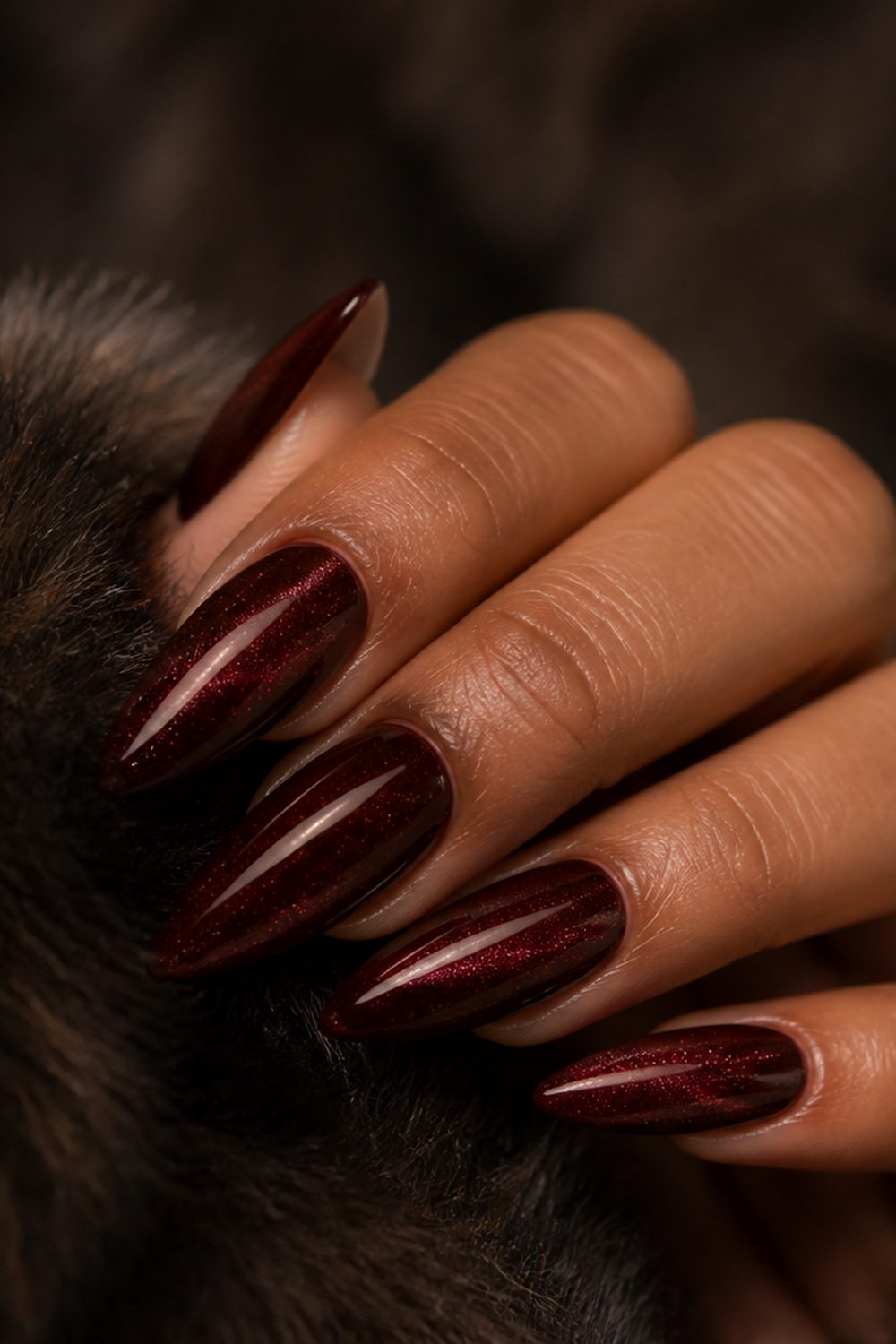 Burgundy cat-eye stiletto nails